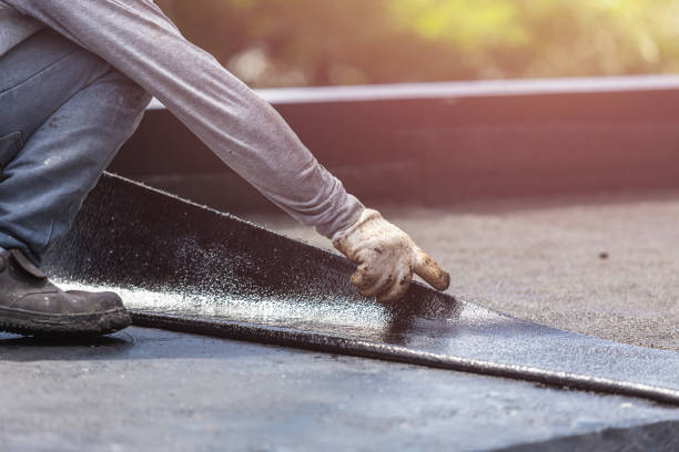 Professional Basement Waterproofing technician working in Bryantown, MD